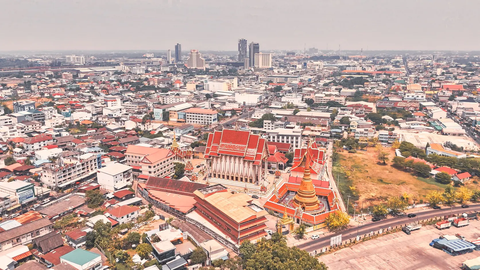 Bangkok rooftops and a temple seen from above
