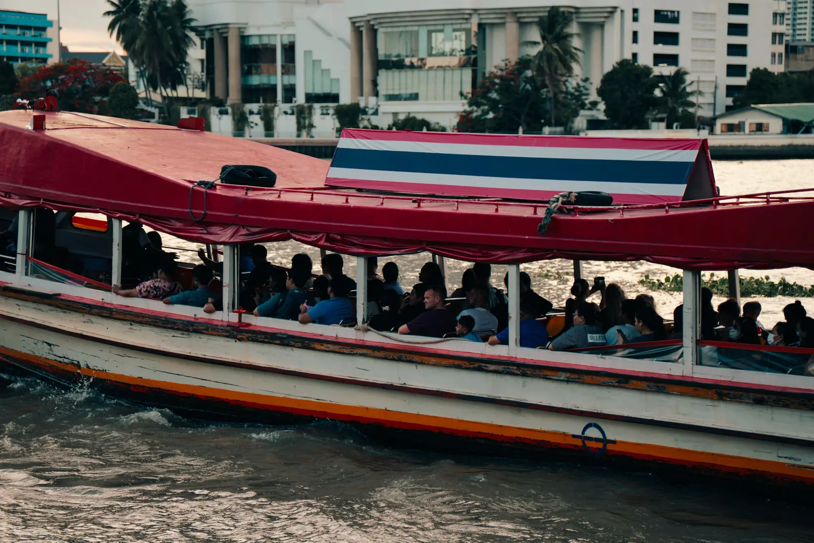 Passengers on a river boat on the Chao Phraya in Bangkok